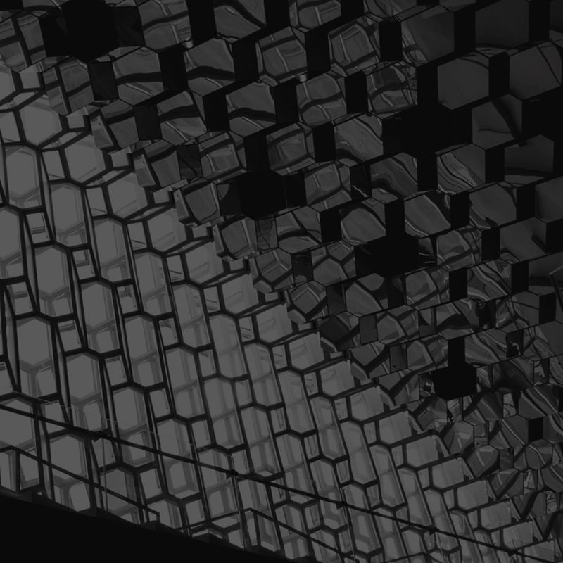 Schwarz-weiß-Abbildung eines kubischen Musters, das durch seine geometrische Struktur und klare Konturen besticht.